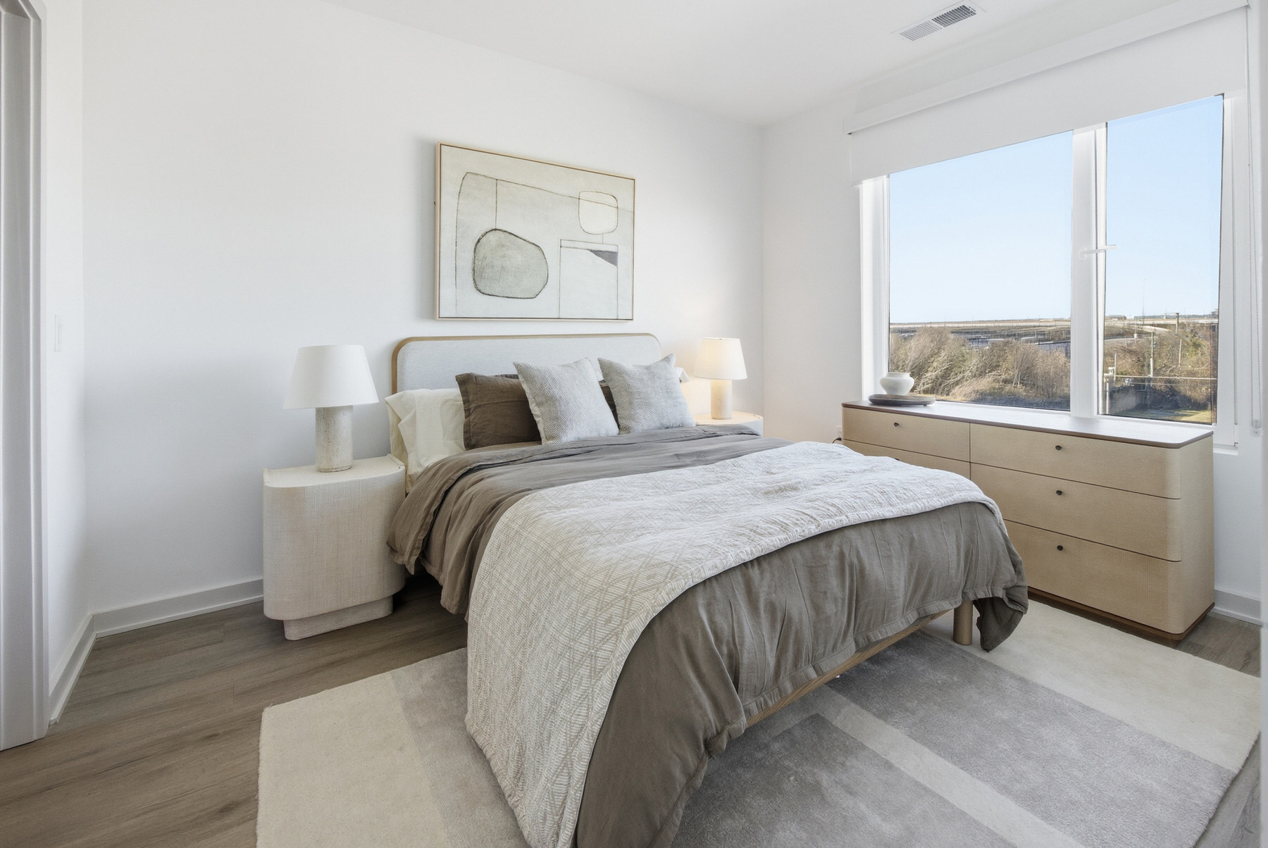 Modern bedroom with large windows and scenic views, real estate photography Baltimore MD