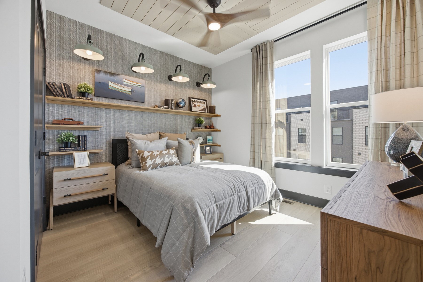 Bedroom with shiplap ceiling and floating shelf headboard wall, real estate photography Central Maryland