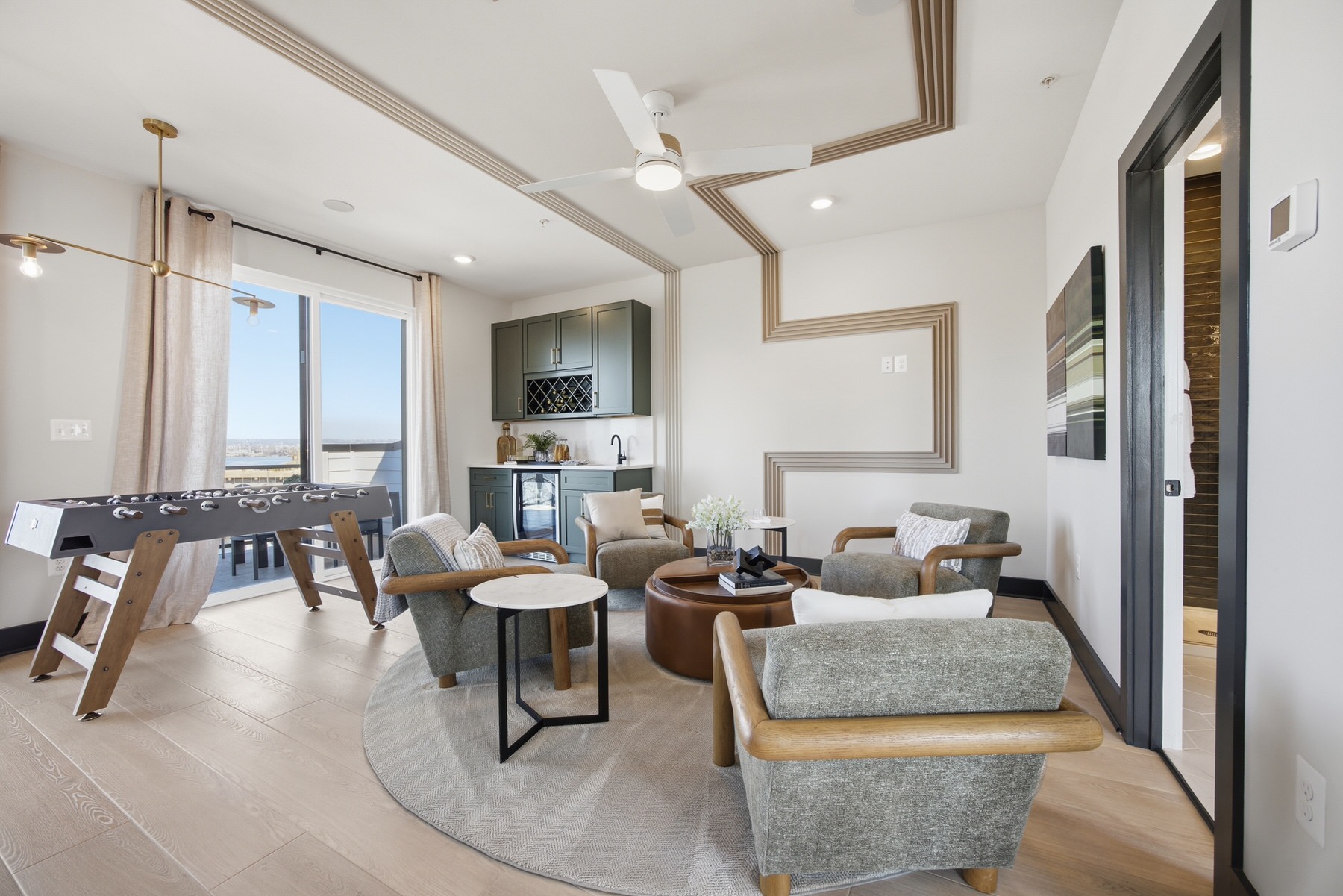 Bonus room with game area, wet bar, and scenic city views, real estate photography Baltimore MD