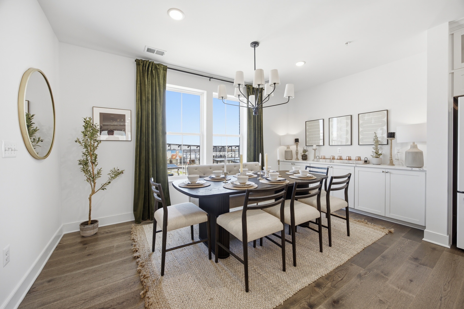 Formal dining room with chandelier and green curtains, real estate photography Baltimore MD