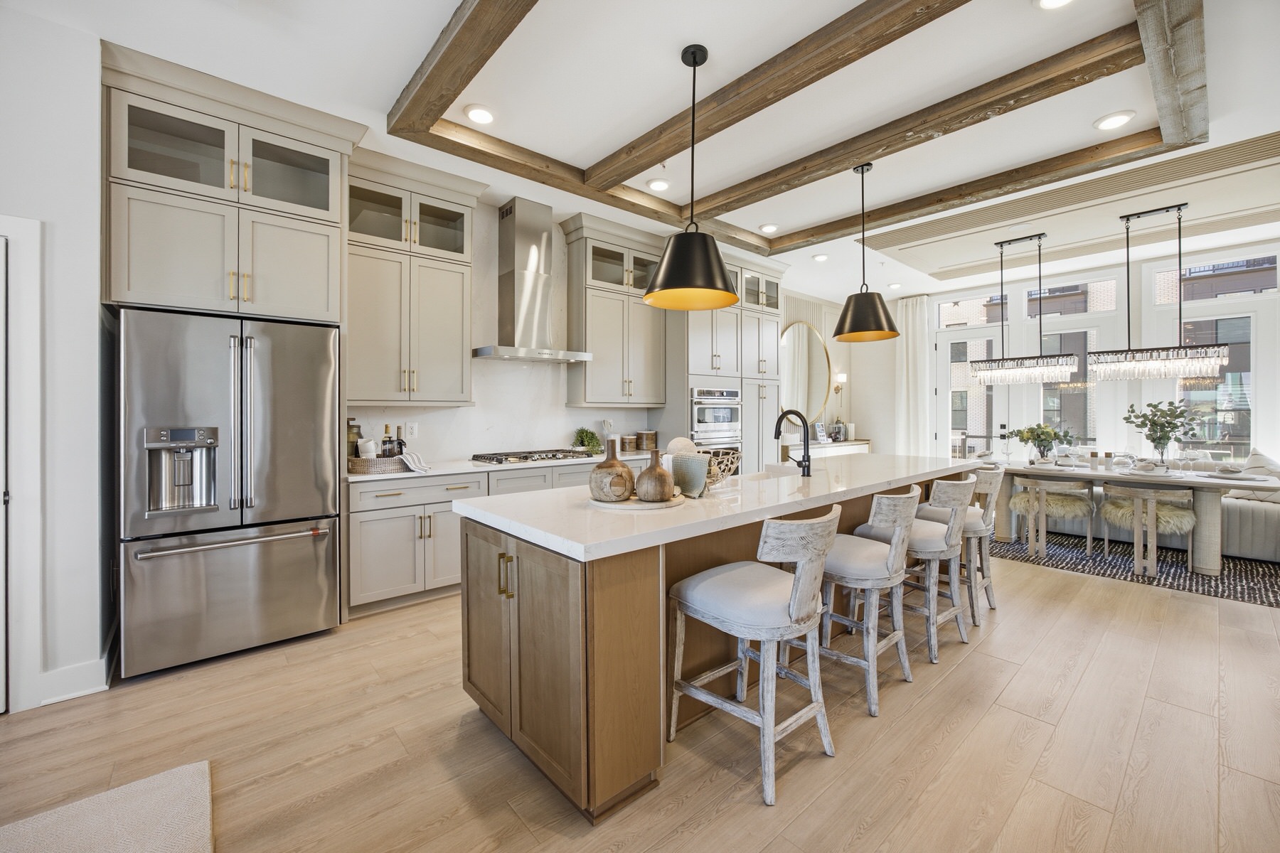 Kitchen with grey cabinets, wood-accented island, and exposed ceiling beams, real estate photography Baltimore MD