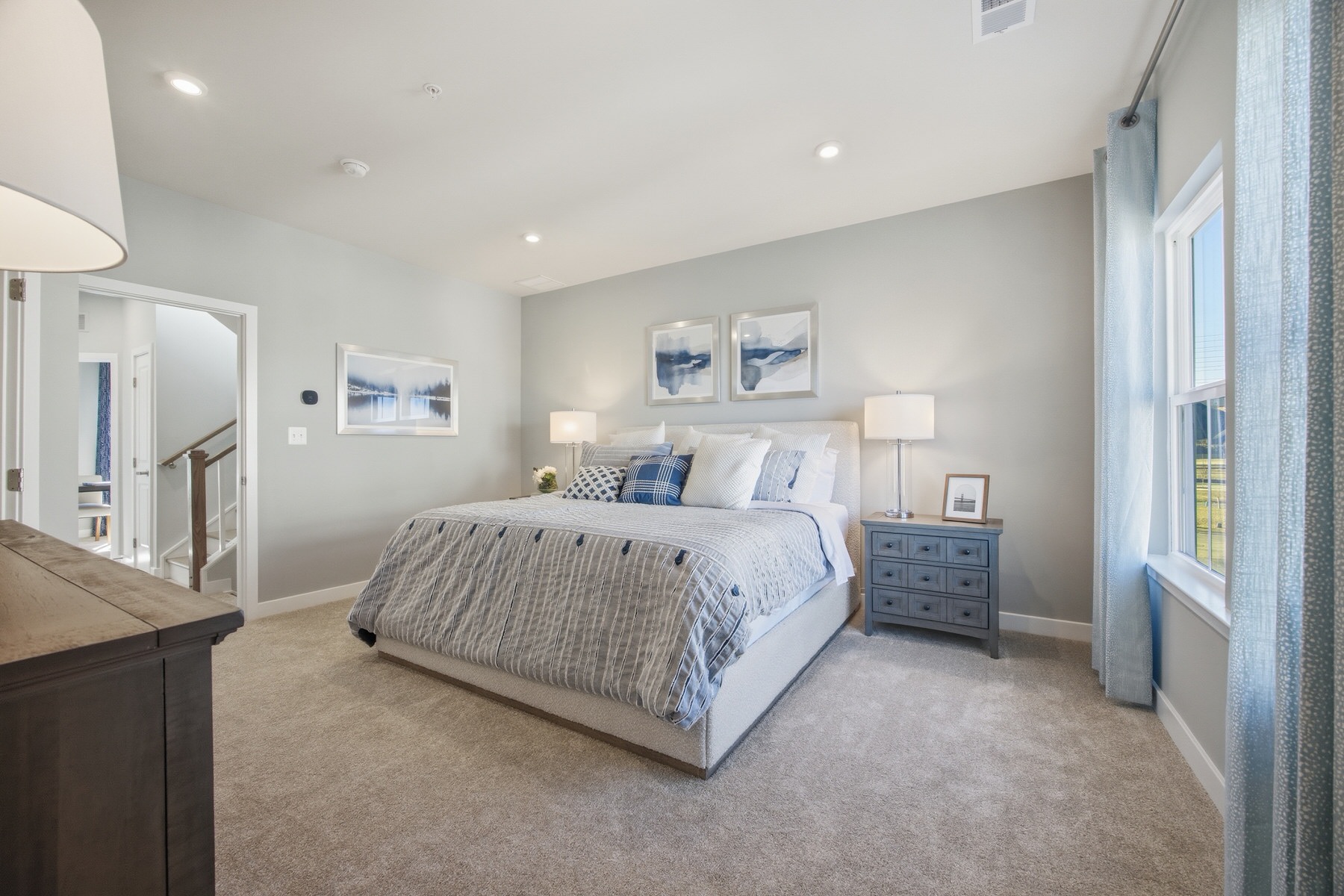 Spacious master bedroom with large windows and abundant natural light, real estate photography Baltimore