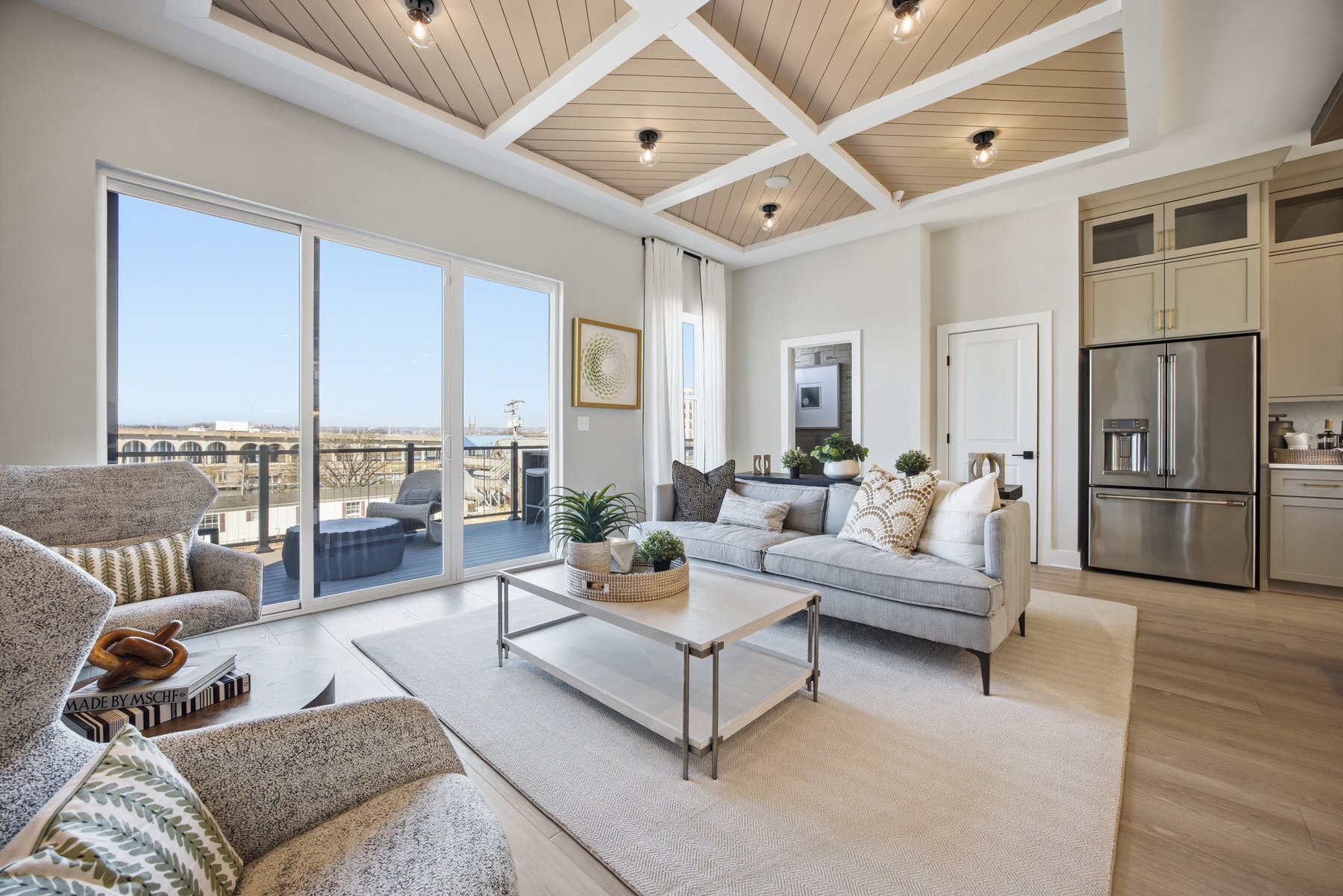 Open-plan living area and kitchen with wood coffered ceiling, real estate photography Central Maryland