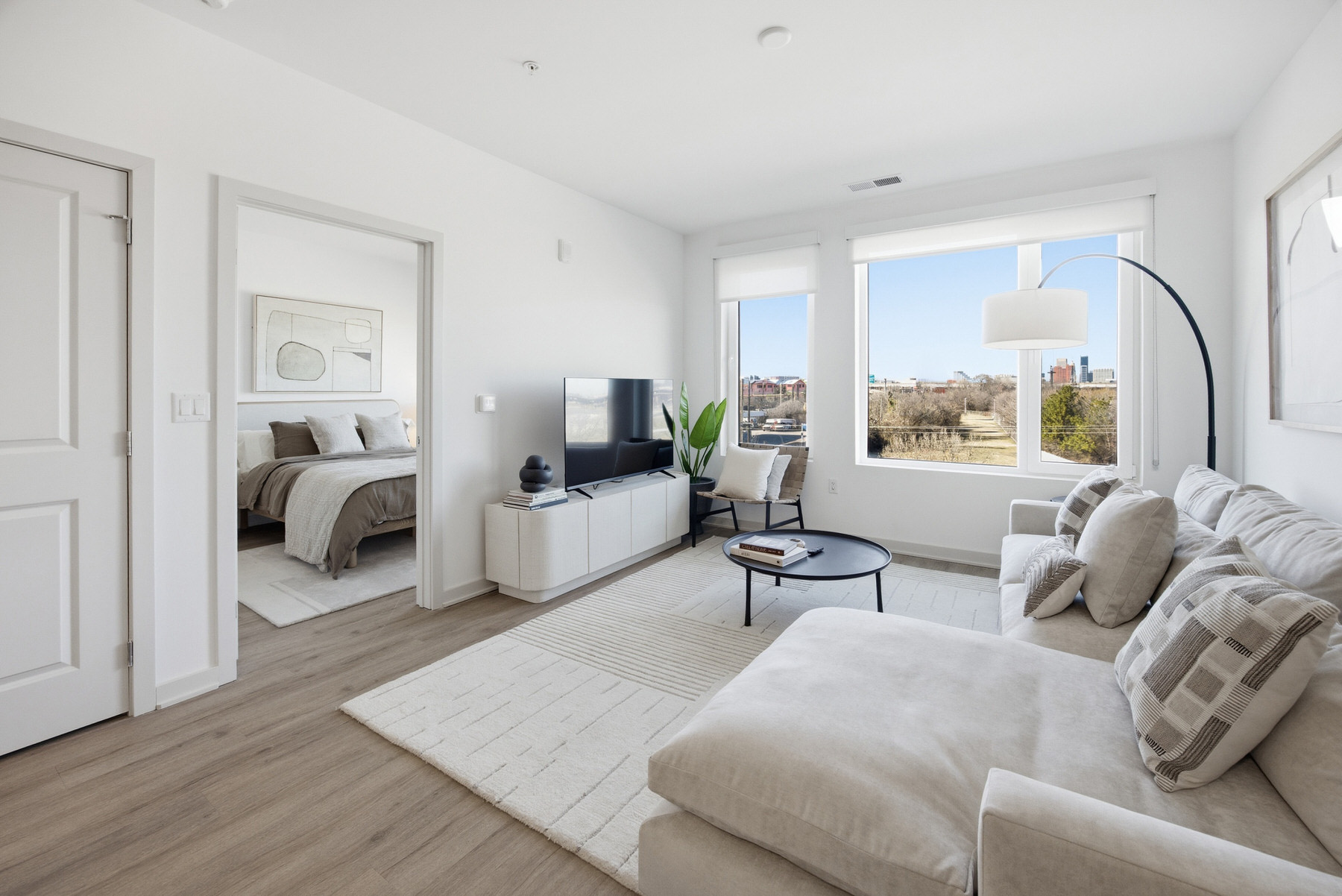 Open-plan living and dining area with city views, real estate photography Baltimore