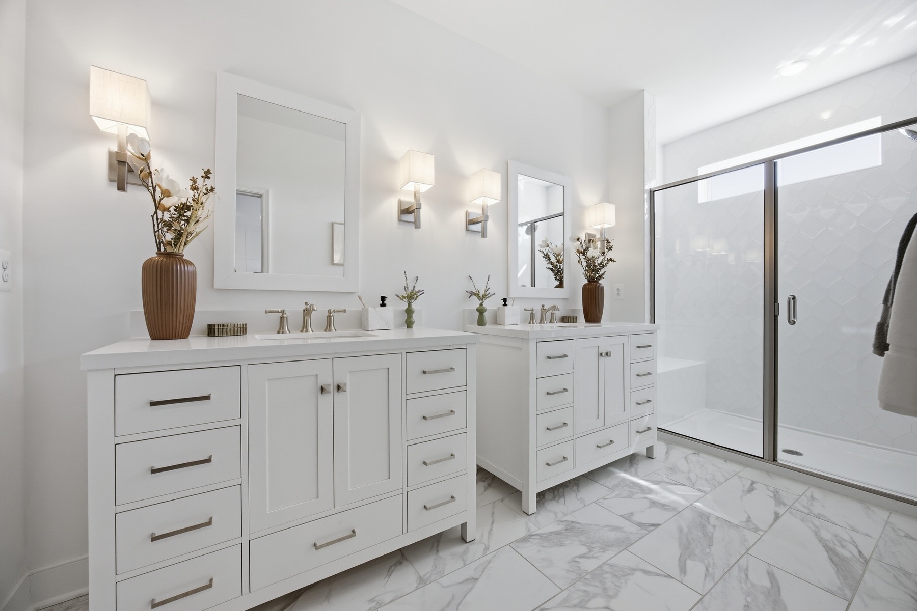 Primary bathroom with double vanity, marble tile floors, and walk-in shower, real estate photography Central Maryland