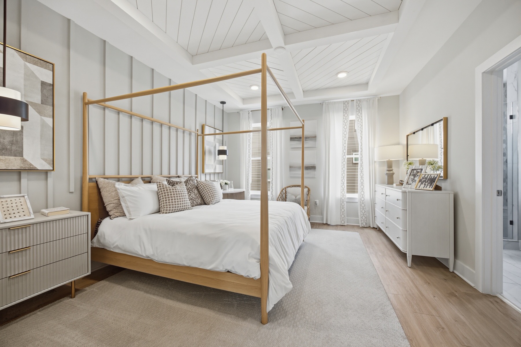 Primary bedroom with four-poster canopy bed and vaulted ceiling, real estate photography Baltimore MD